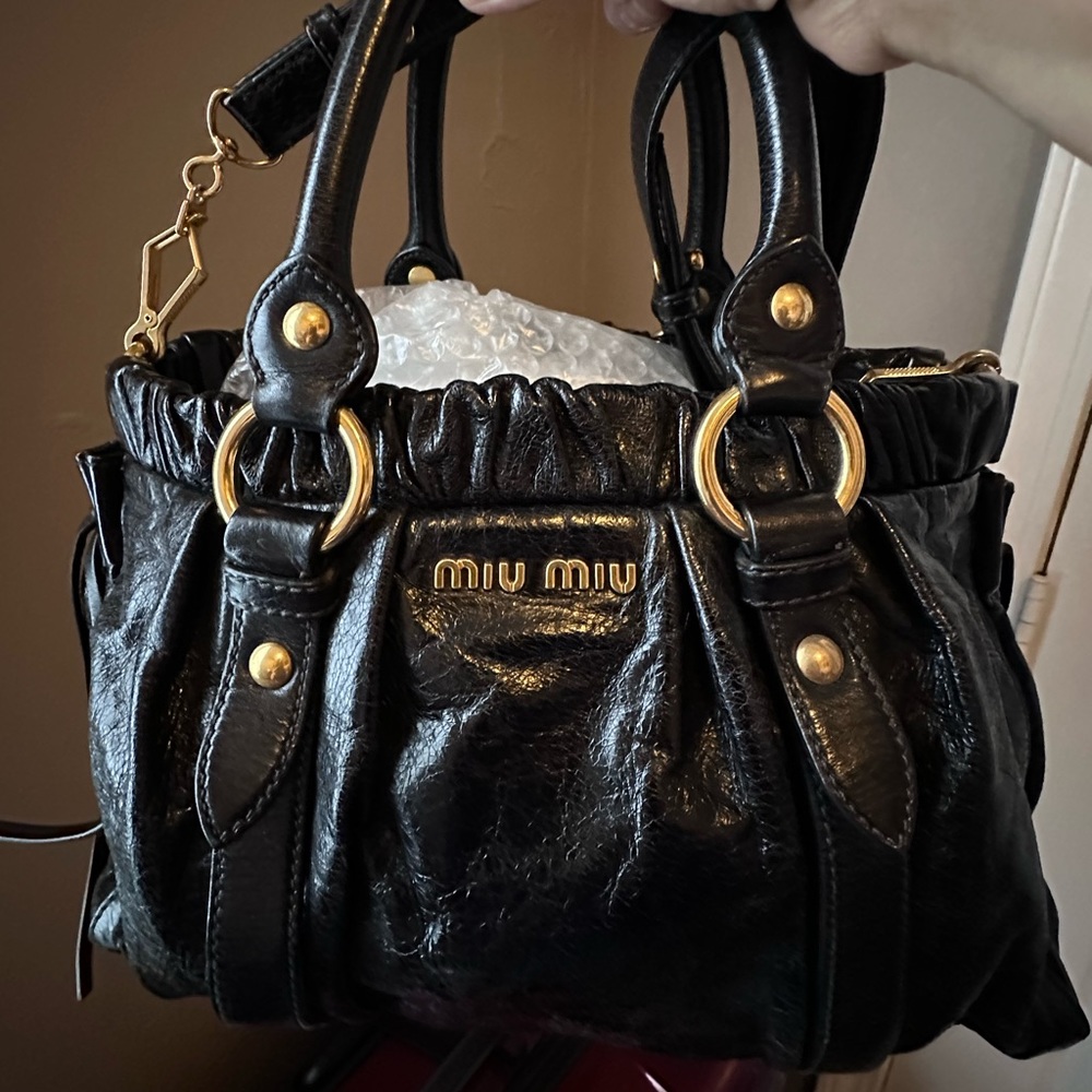 Authentic Mui Mui two way shoulder bag. Distress Black leather bag.